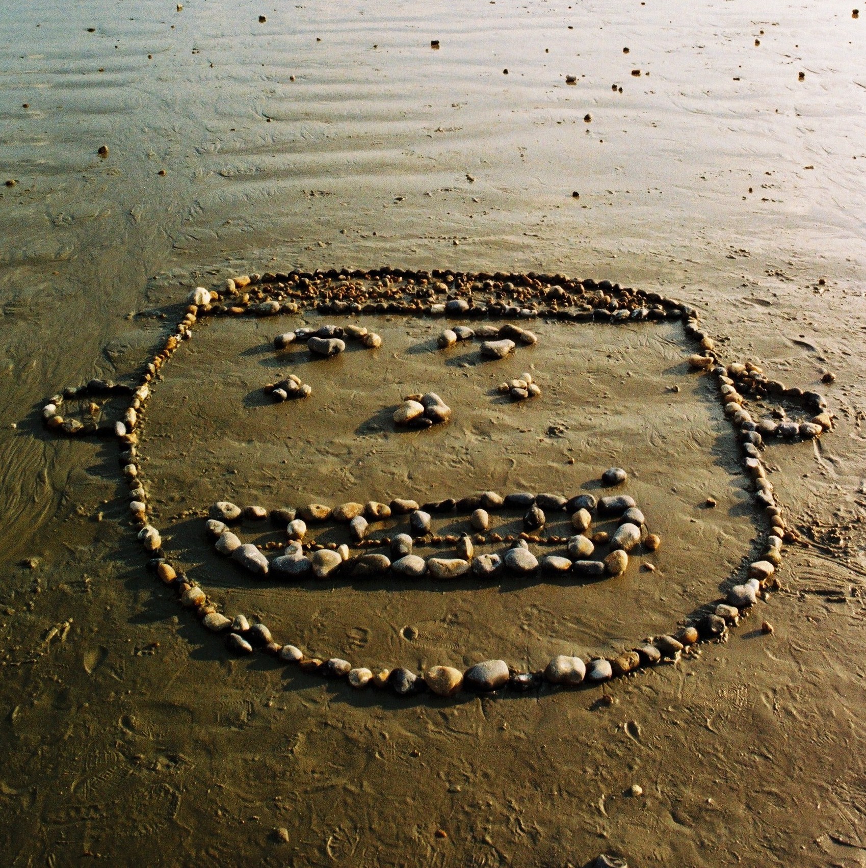 smiley face made of pebbles
